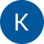 White letter K centered on a blue circular background.