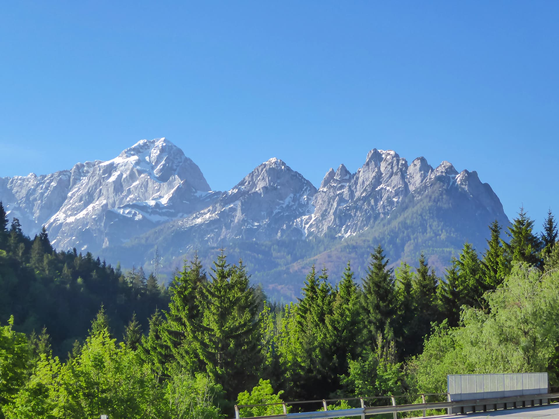 Scenic view of mountain peak Mangart in Julian Alps at Slovenia Italy boarder seen from Alpe Adria trail in Friuli-Venezia Giulia, Italy, Europe. Peaceful serene scene in Italian mountain in summer