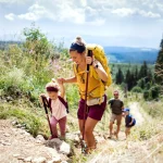 family,with,small,children,hiking,outdoors,in,summer,nature,,walking