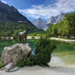 Lake Jasna and mountain goat statue in Kranjska Gora, Slovenia